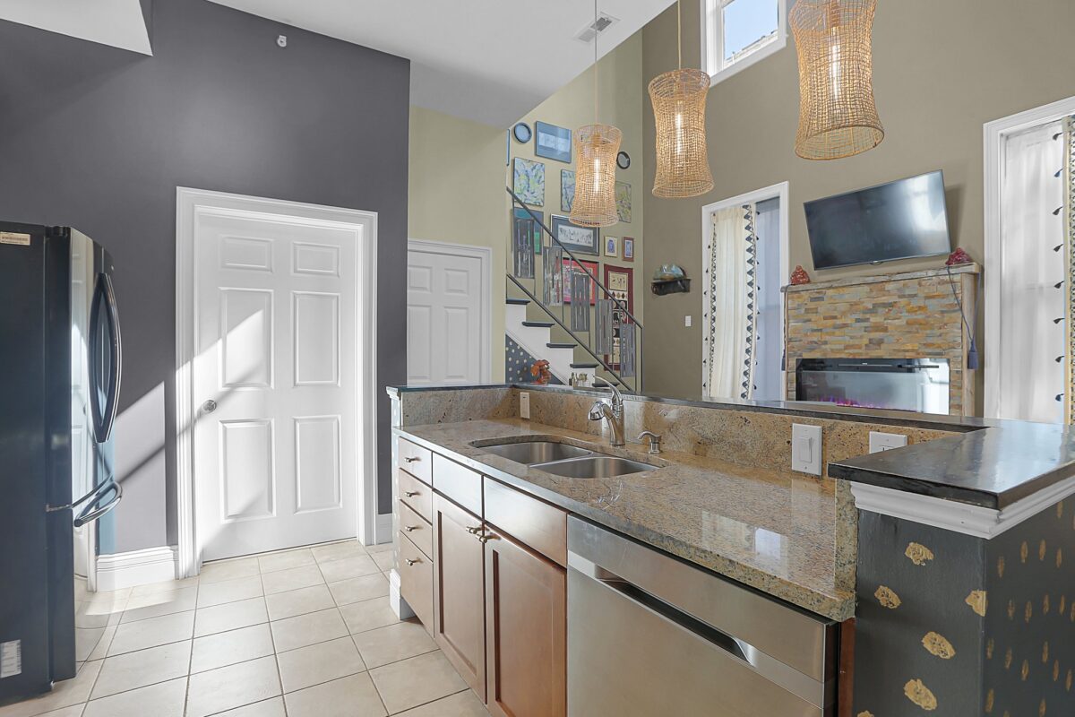 Breakfast bar with double sink and pendant lights