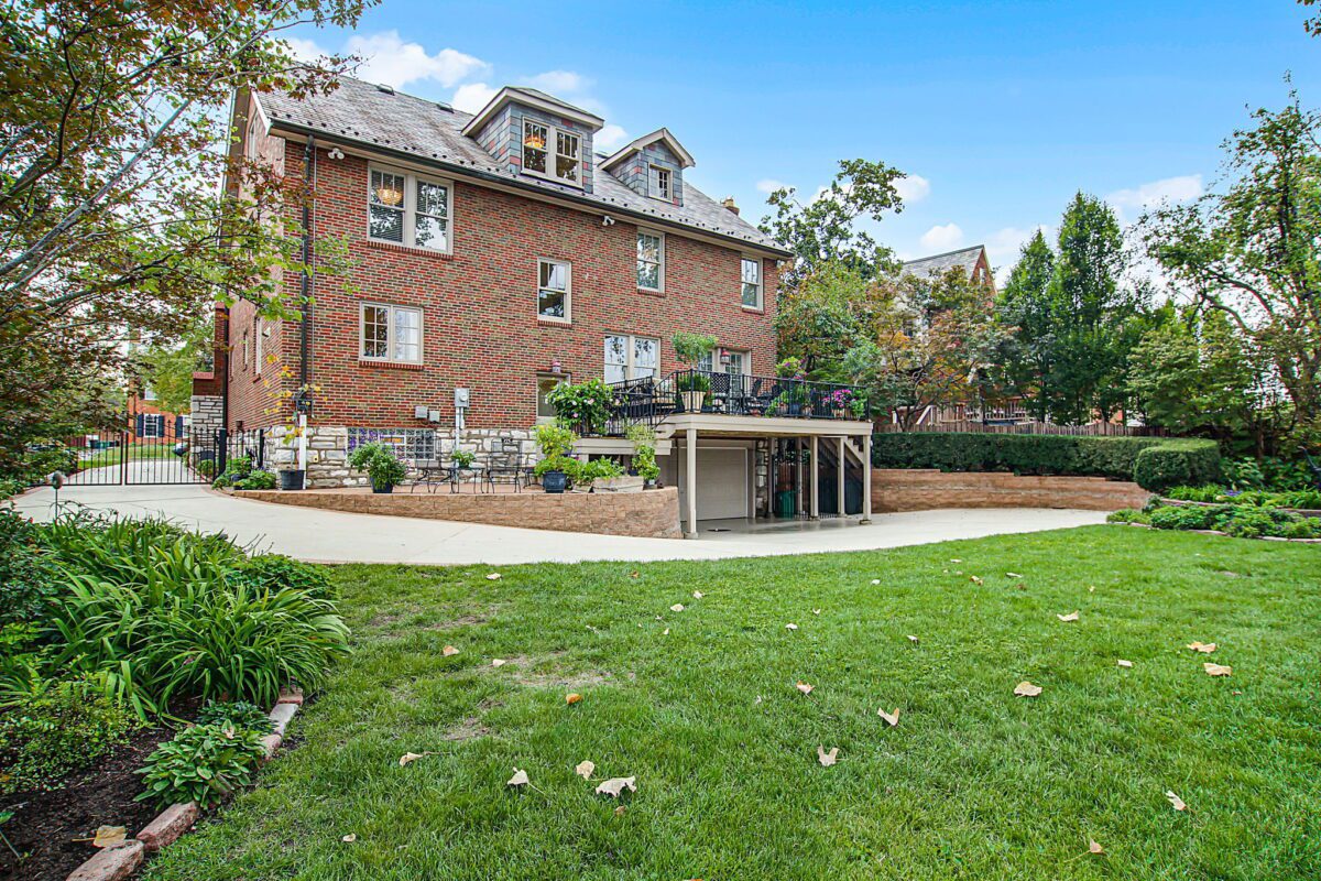 Brick house with lawn and garden.