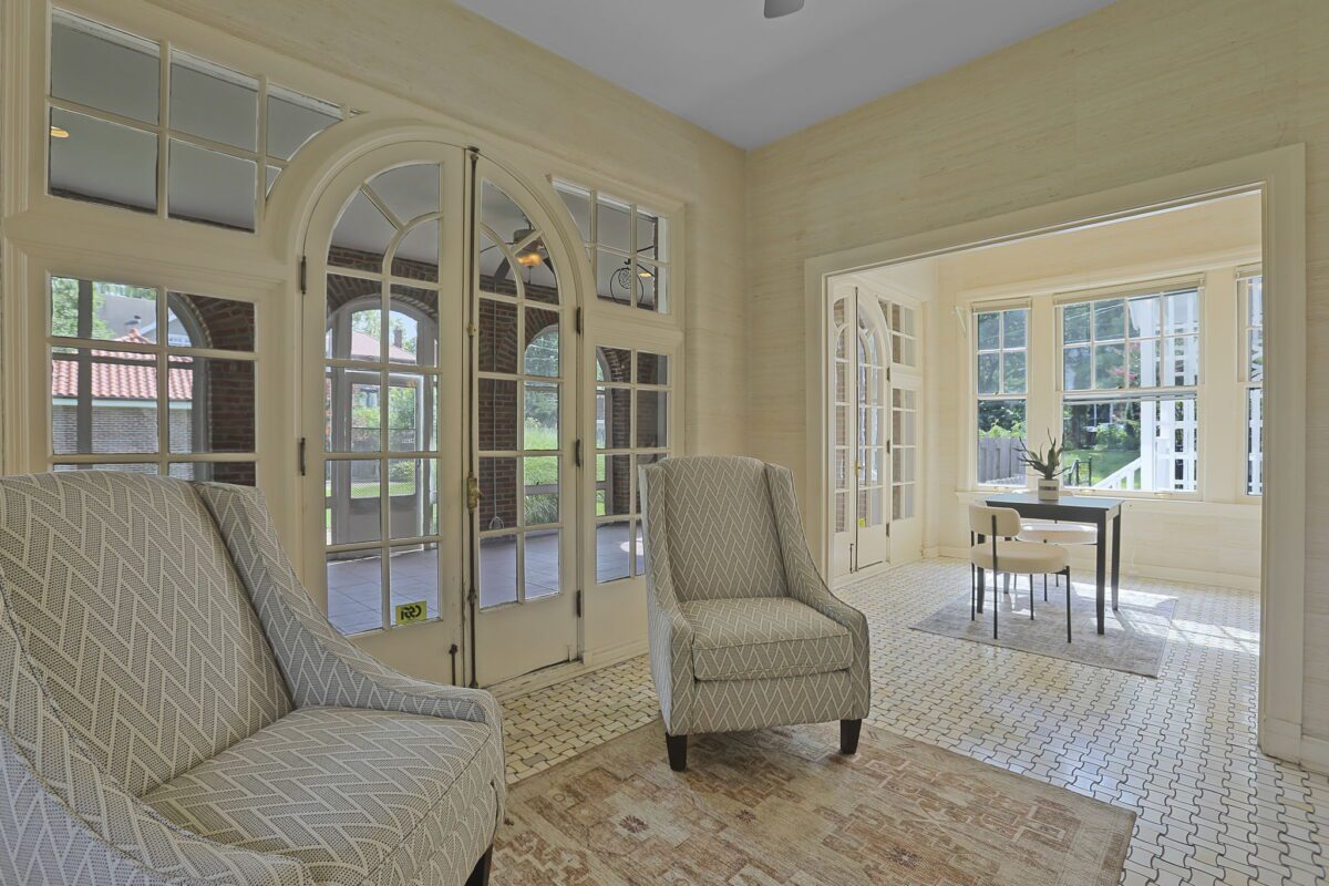 Sunlit sitting room with arched French doors